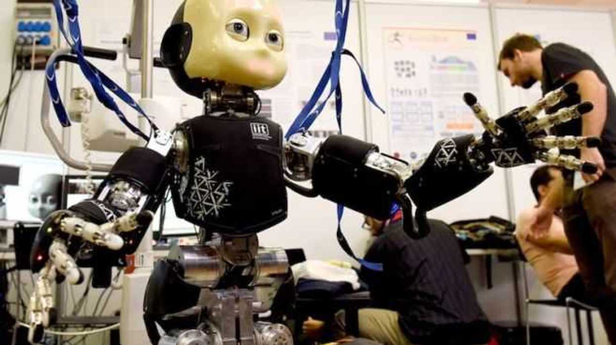 An iCub robot made by the Italian Institute of Technology is pictured at the scientists congress IROS 2015 in Hamburg