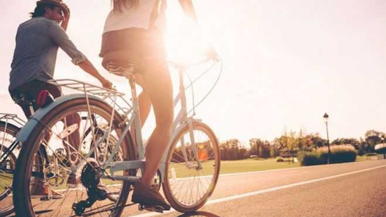 Cycling,Together.,Low,Angle,View,Of,Young,People,Riding,Bicycles