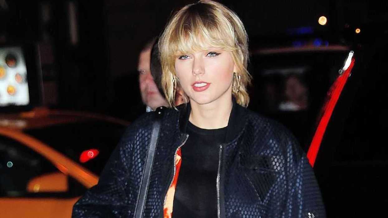 Taylor Swift holds hands with Lorde at the Kings of Leon concert in New York